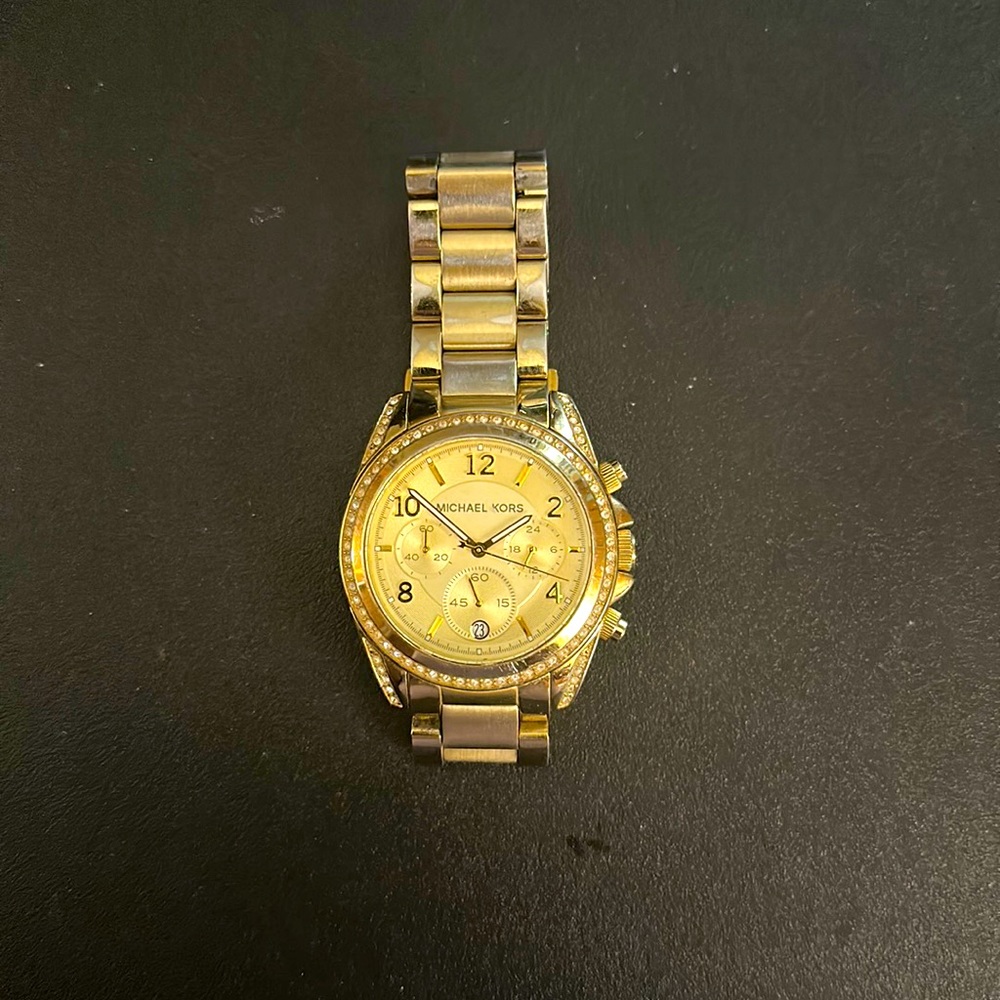 Michael Kors ladies watch, used, color is gold (varnished from wear)